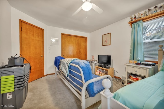 bedroom with light colored carpet and ceiling fan