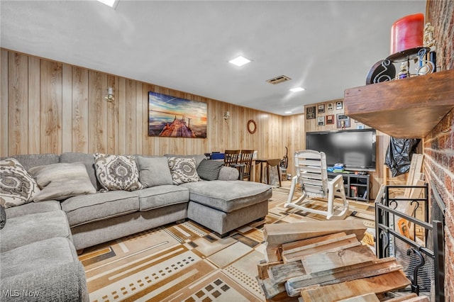 living room with wood walls