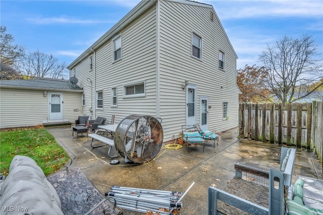 back of property with a patio