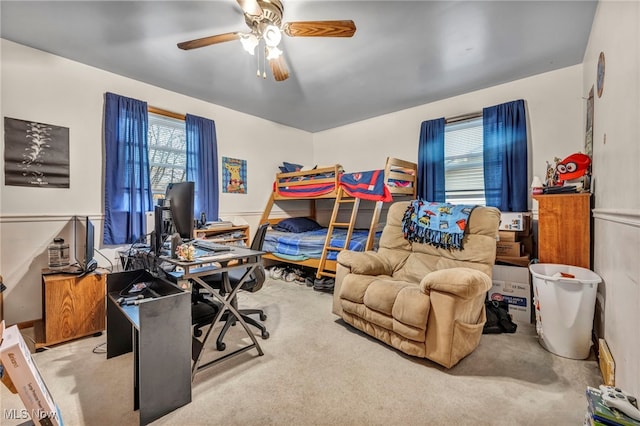 carpeted bedroom featuring ceiling fan