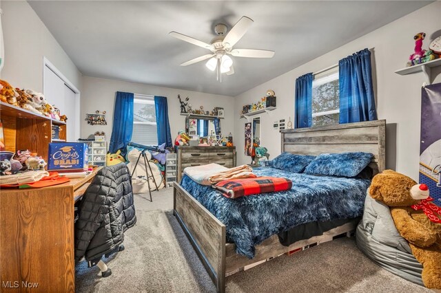 bedroom with light carpet and ceiling fan