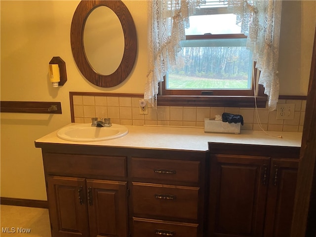 bathroom with decorative backsplash and vanity