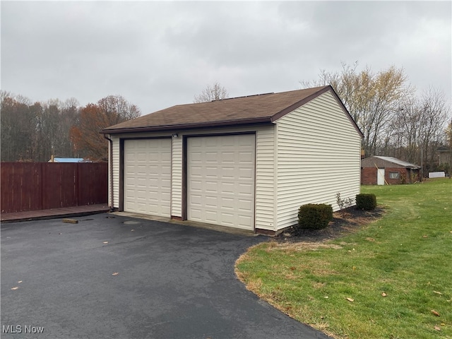 garage with a yard