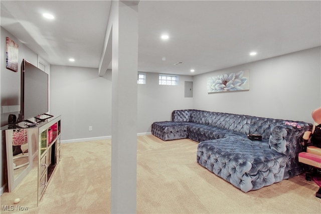 carpeted living room featuring electric panel