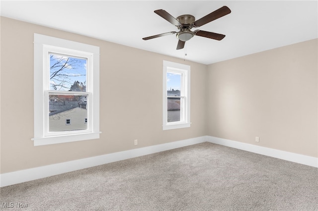 empty room featuring carpet and ceiling fan