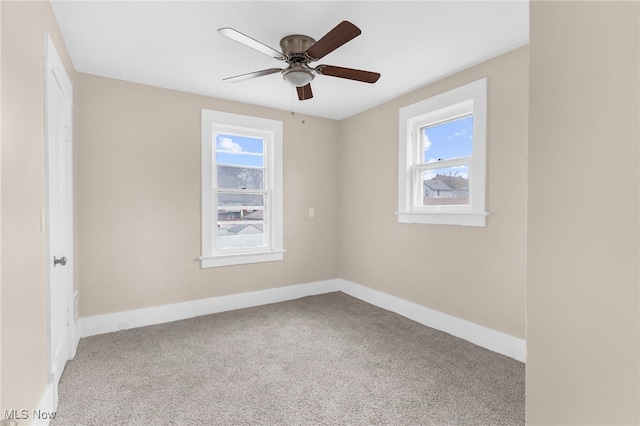 unfurnished room featuring ceiling fan, light carpet, and a healthy amount of sunlight