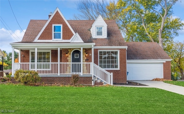 view of front facade with a front lawn, a garage, and covered porch