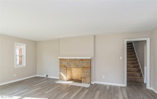 unfurnished living room featuring light wood-type flooring