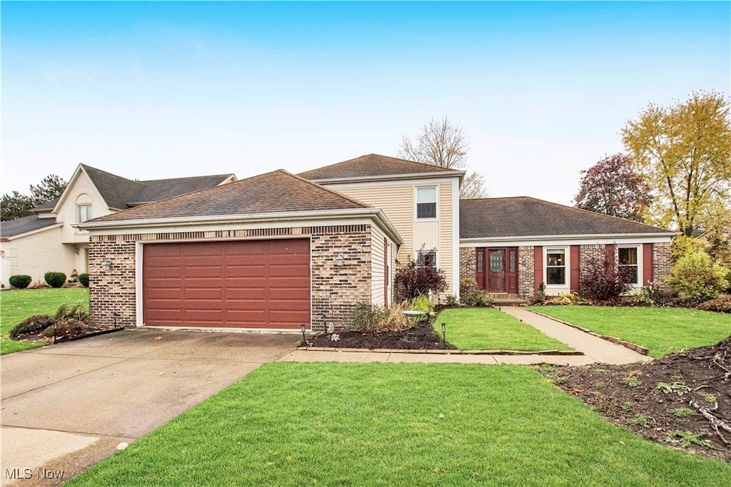 ranch-style house with a front lawn and a garage