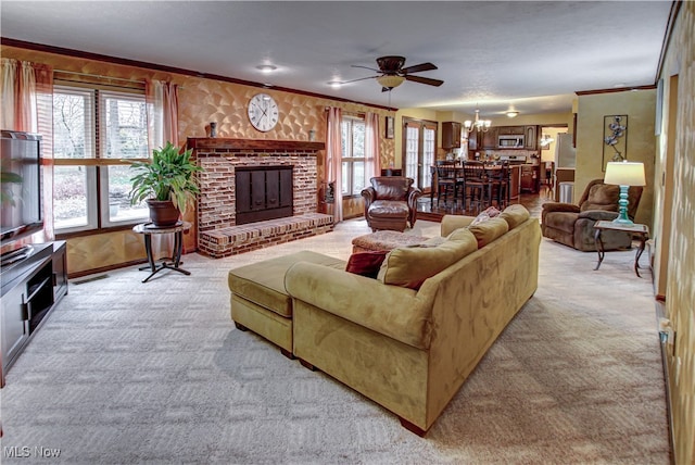 carpeted living room featuring ornamental molding, a brick fireplace, and plenty of natural light