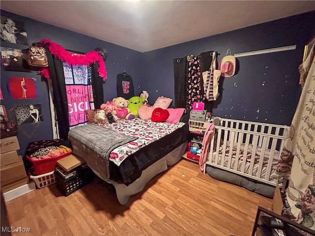 bedroom featuring wood-type flooring