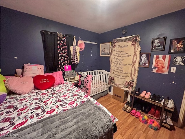 bedroom featuring hardwood / wood-style flooring