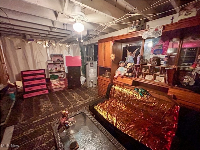 basement featuring gas water heater and ceiling fan