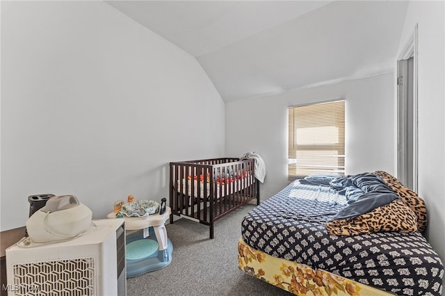 carpeted bedroom featuring lofted ceiling