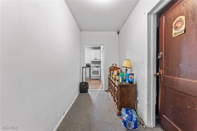 hallway with carpet floors