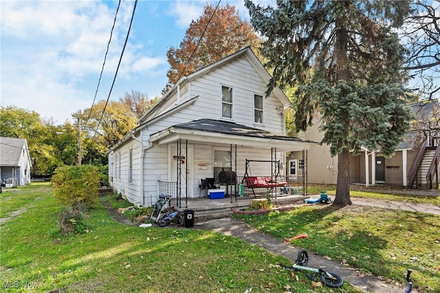 view of front of house featuring a front lawn and a porch