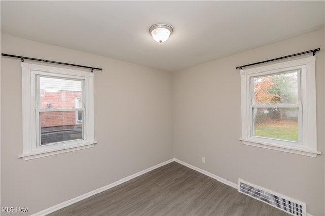 spare room with hardwood / wood-style flooring