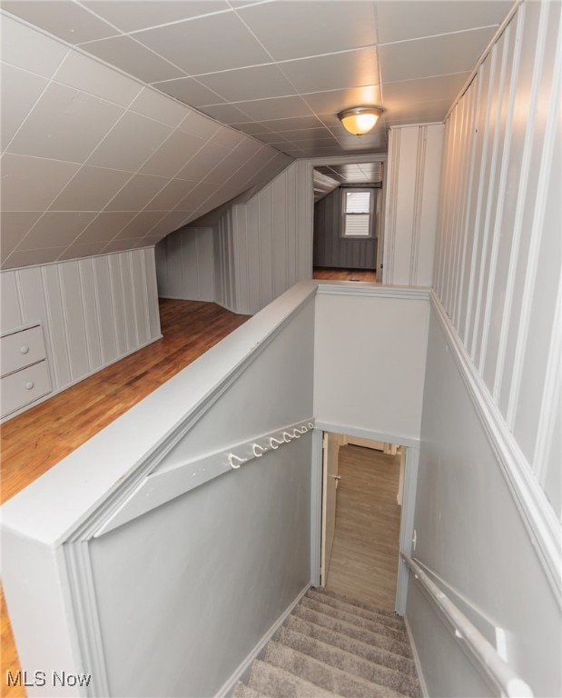 staircase featuring vaulted ceiling