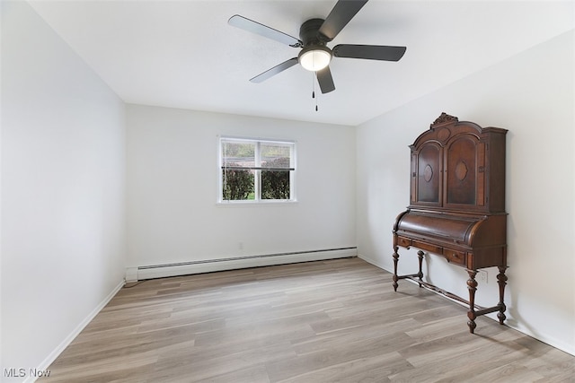 interior space featuring baseboard heating, light wood-type flooring, and ceiling fan