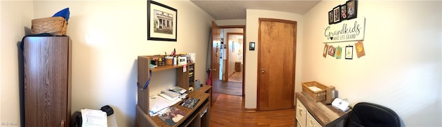 corridor with hardwood / wood-style floors