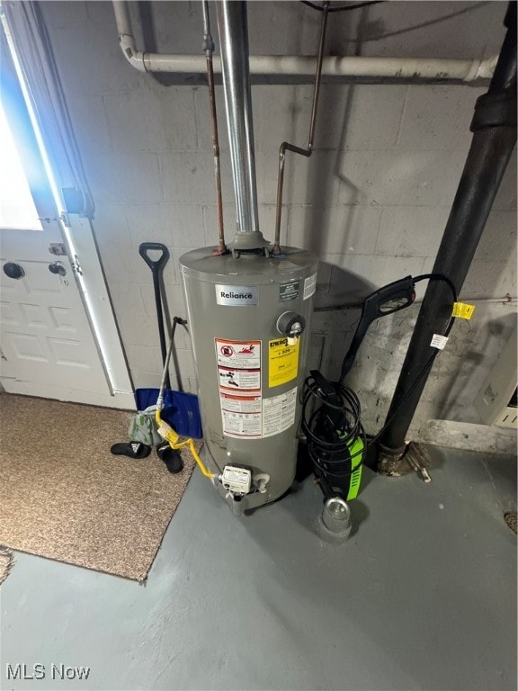 utility room featuring gas water heater