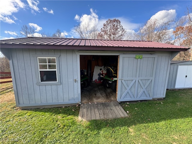 view of outdoor structure with a yard