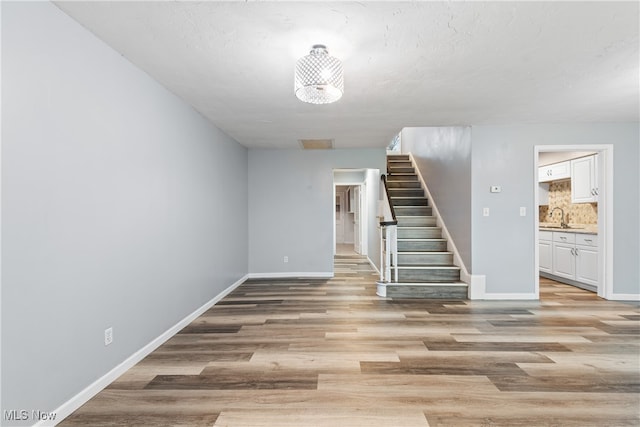 interior space featuring light wood-type flooring and sink