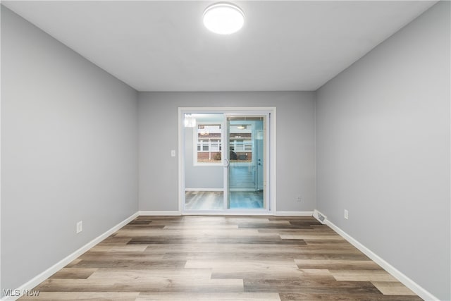 unfurnished room featuring light hardwood / wood-style flooring