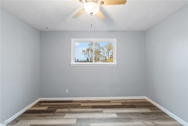 unfurnished room featuring hardwood / wood-style flooring and ceiling fan