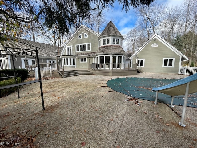 rear view of property featuring a patio