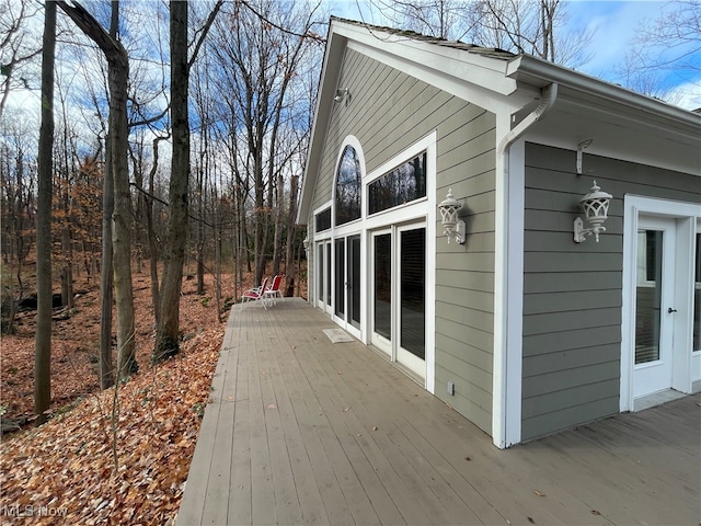 view of side of home featuring a wooden deck