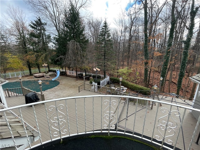 exterior space featuring a deck and a fire pit