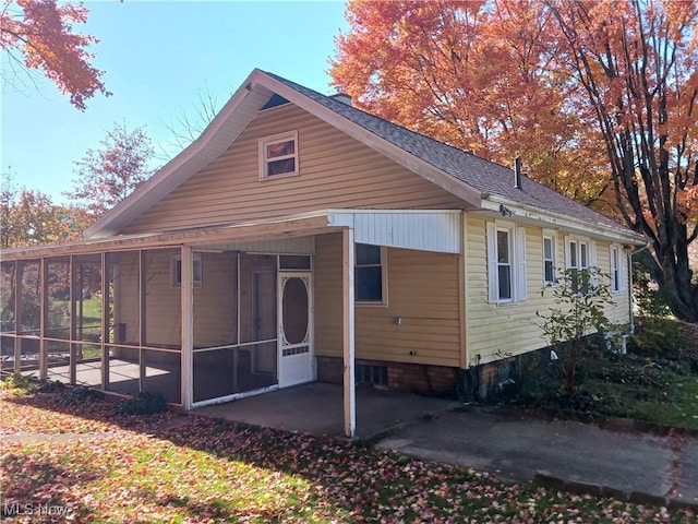 exterior space with a sunroom