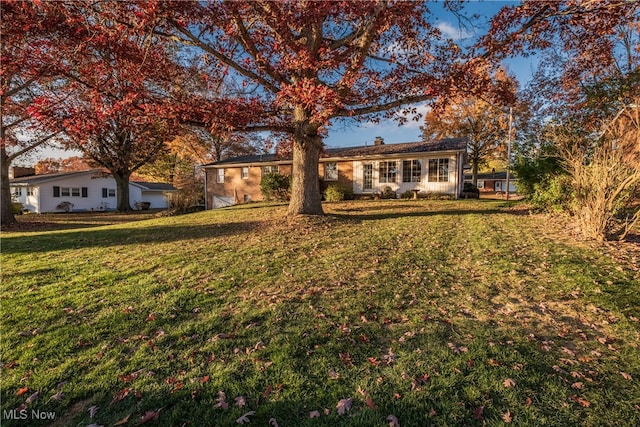 view of front of home with a front lawn