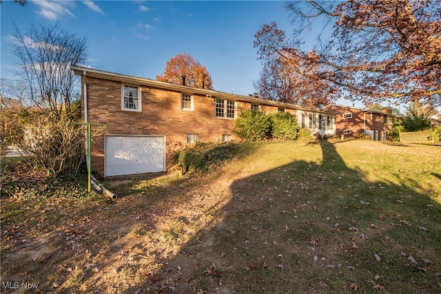 rear view of house with a yard