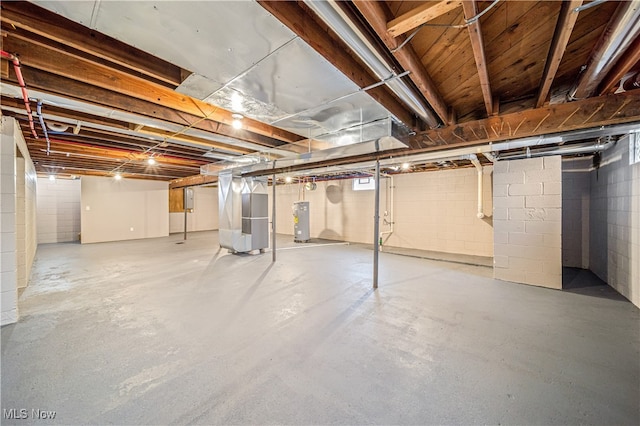 basement with heating unit and electric water heater