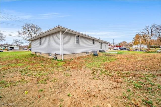 view of property exterior with central AC