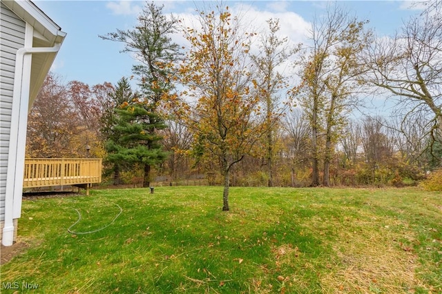 view of yard with a wooden deck