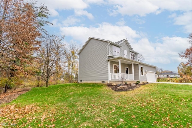 view of side of home featuring a porch, a yard, and a garage