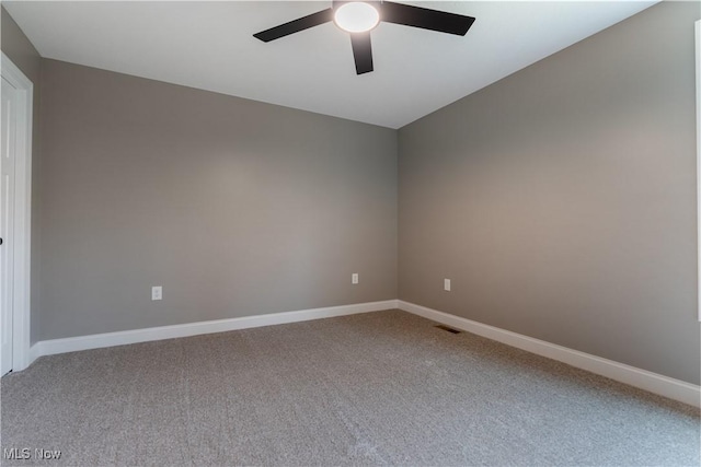 unfurnished room featuring carpet flooring and ceiling fan