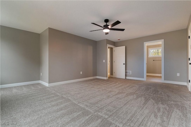 interior space with light carpet and ceiling fan