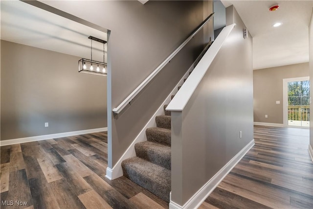 stairway featuring hardwood / wood-style floors