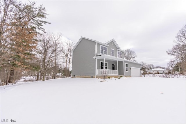 view of front of property with a porch and a garage