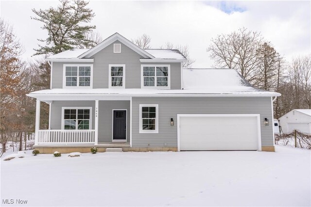 view of front of home with a garage and covered porch