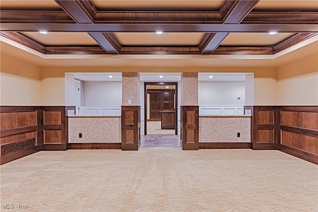 empty room with beamed ceiling, carpet floors, and coffered ceiling