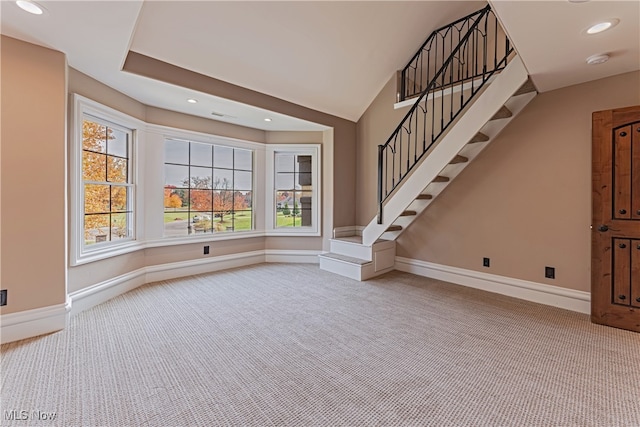 unfurnished living room featuring carpet floors