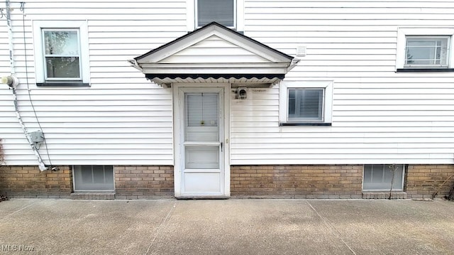 doorway to property with a patio area