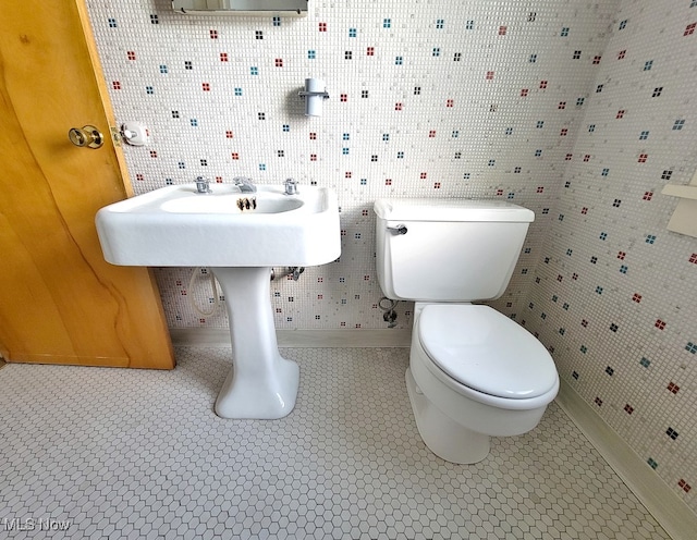 bathroom with tile patterned flooring and toilet