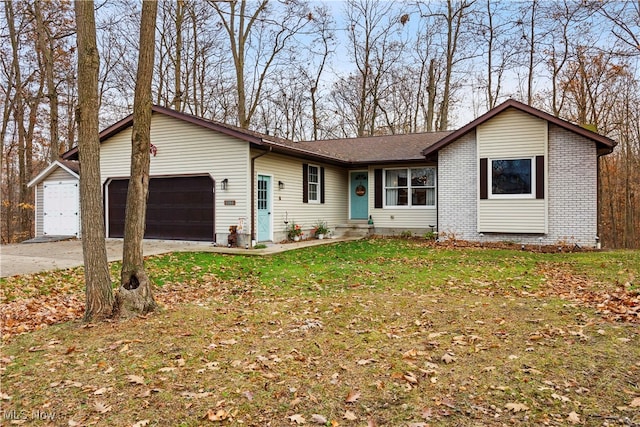 ranch-style home with a garage and a front lawn