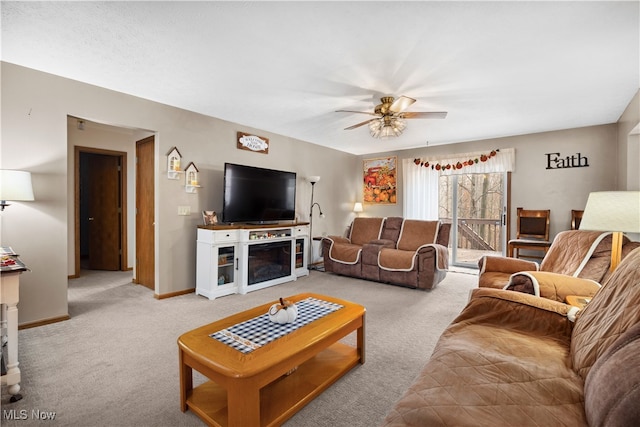 living room with light carpet and ceiling fan